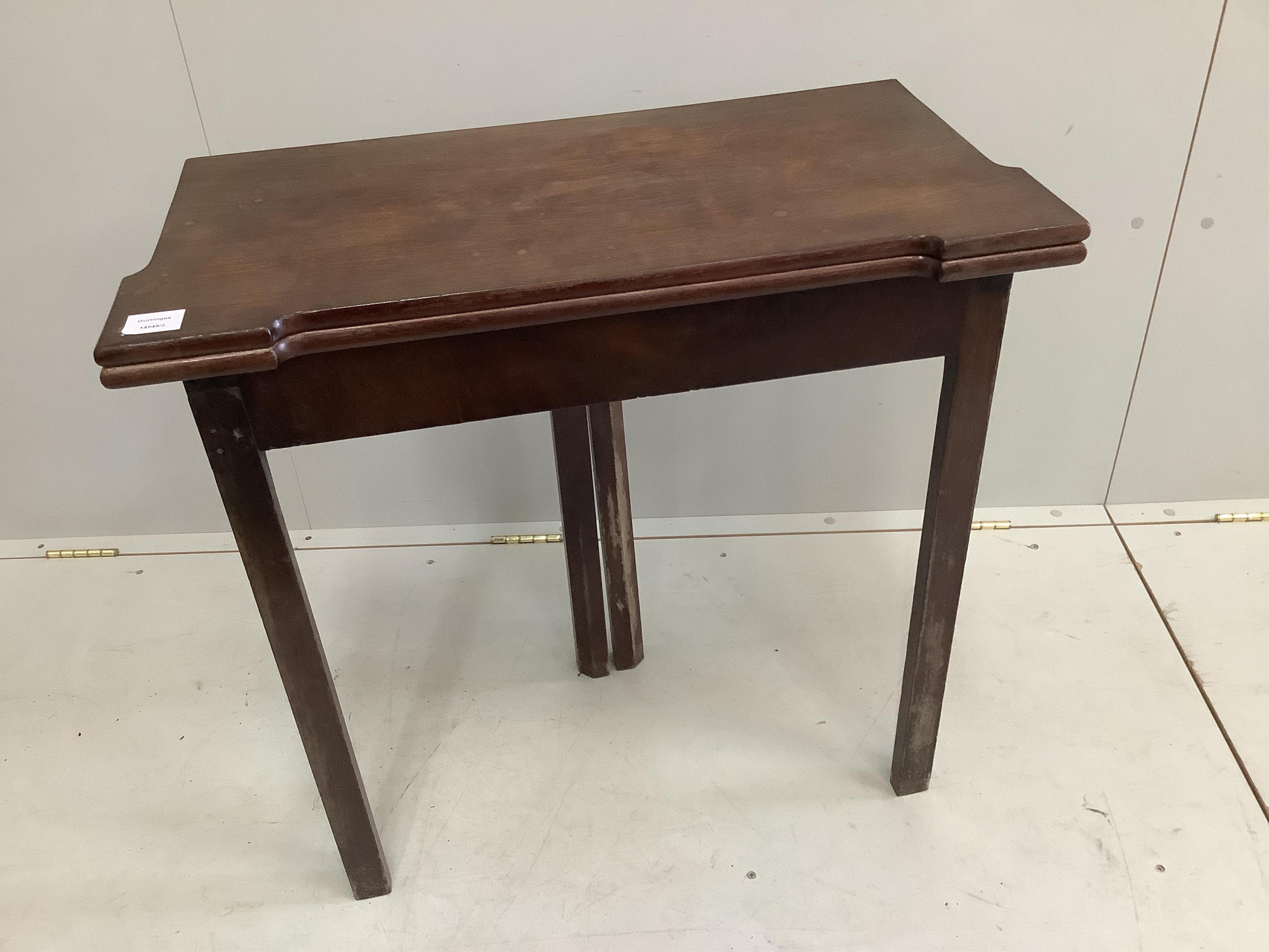 A George III mahogany folding card table, width 74cm, depth 37cm, height 73cm. Condition - fair